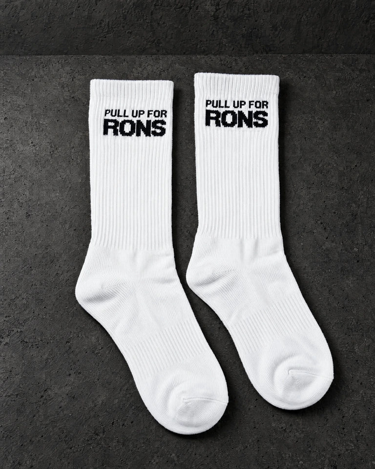 pull up for rons white pair on a charcoal studio surface — Projectprint