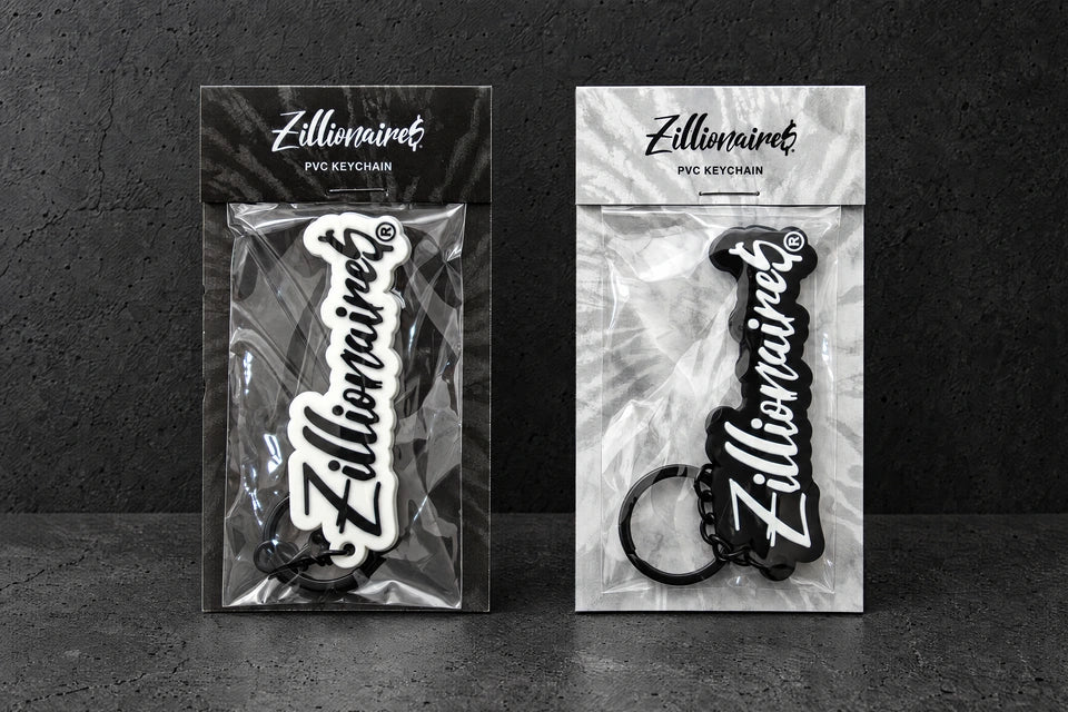 custom soft pvc keyrings on a charcoal studio surface — Projectprint